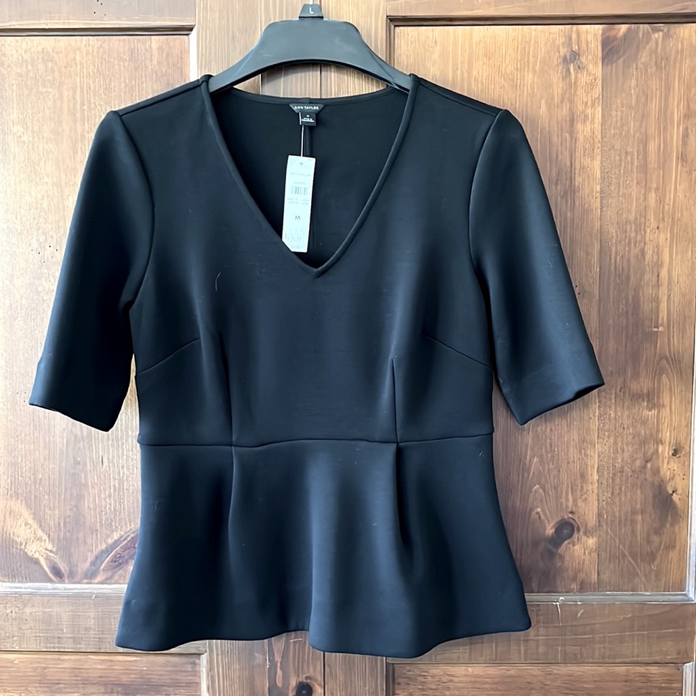 Ann Taylor peplum top size Medium. Never been worn still has tags.
